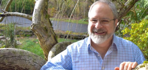 Eric Thorton the master spiritual healer, medium, author and exorcist; is posing front view while smiling